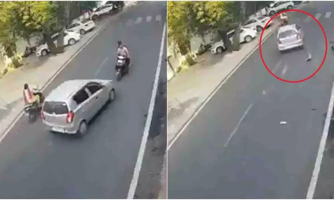 Jhansi में SSP बंगले के सामने एक तेज रफ्तार कार ने स्कूटी को जोरदार टक्कर मार दी। हादसे में दोनों स्कूटी सवार हवा में उछलकर दूर जा गिरे, लेकिन बाल-बाल बच गए। कार चालक मौके से फरार हो गया। घटना का लाइव वीडियो वायरल है।